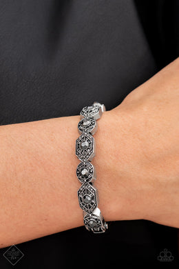 Eye-Opening Opulence Silver Hinged Closure Bracelet Paparazzi Accessories. Get Free Shipping.