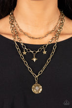 Load image into Gallery viewer, Under the Northern Lights Brass Star Necklace Paparazzi Accessories. Get Free Shipping. 
